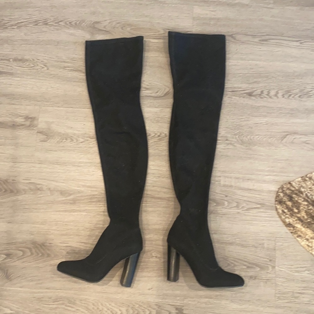Thigh high black boots with light sparkle